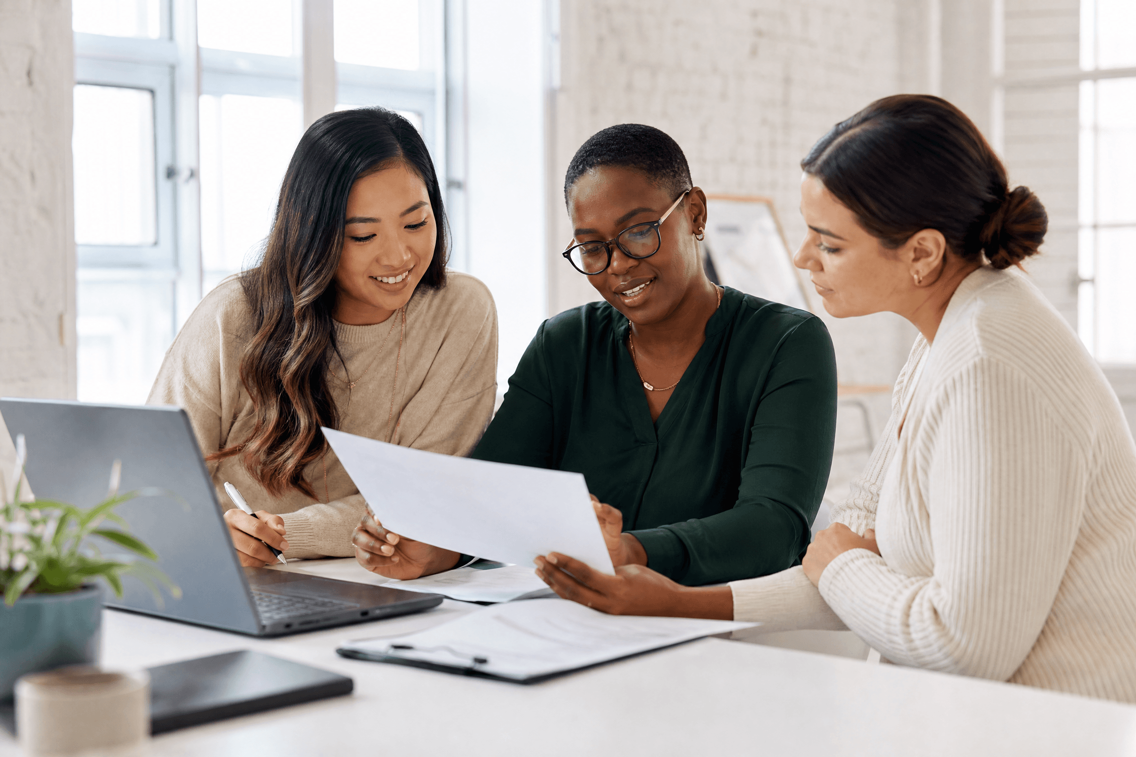 Editorial team reviewing research together